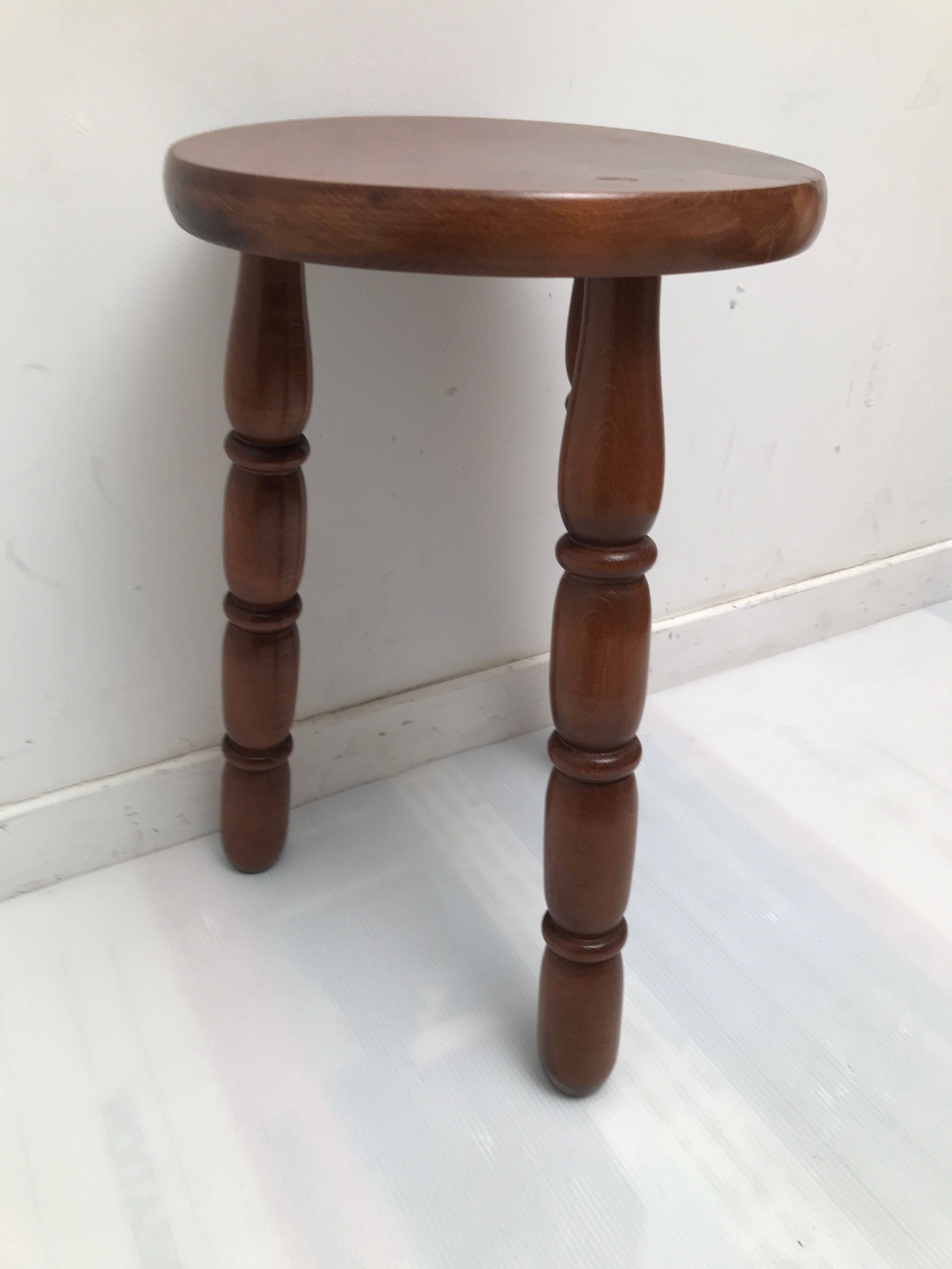 Wooden stool turned tripod foot