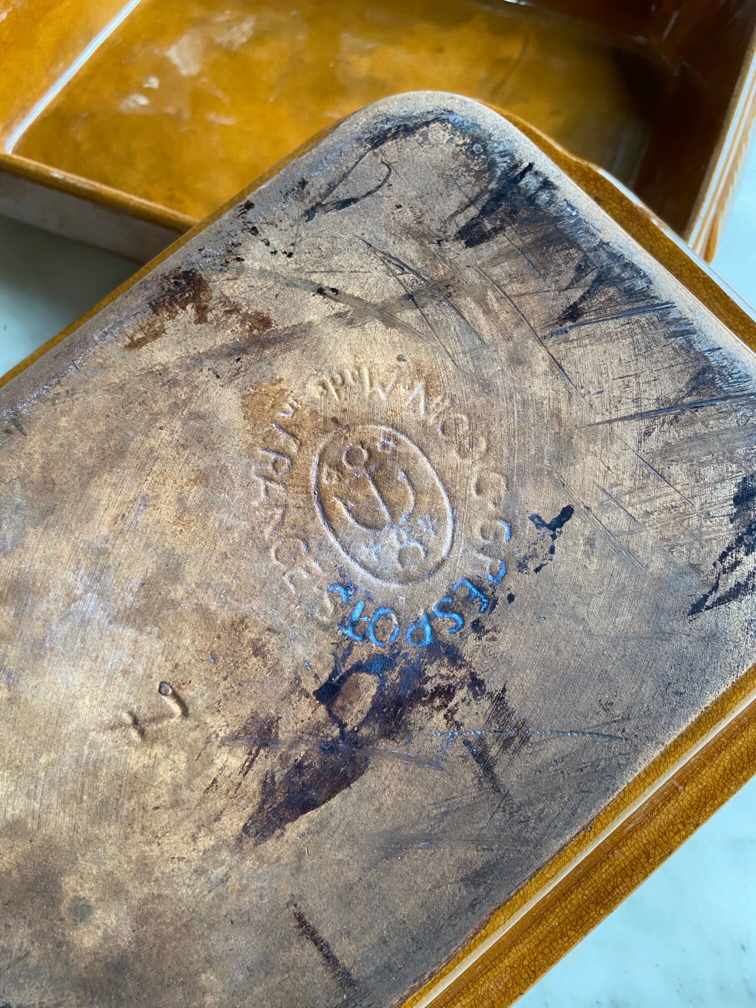 Pair of rectangular enamelled sandstone dishes