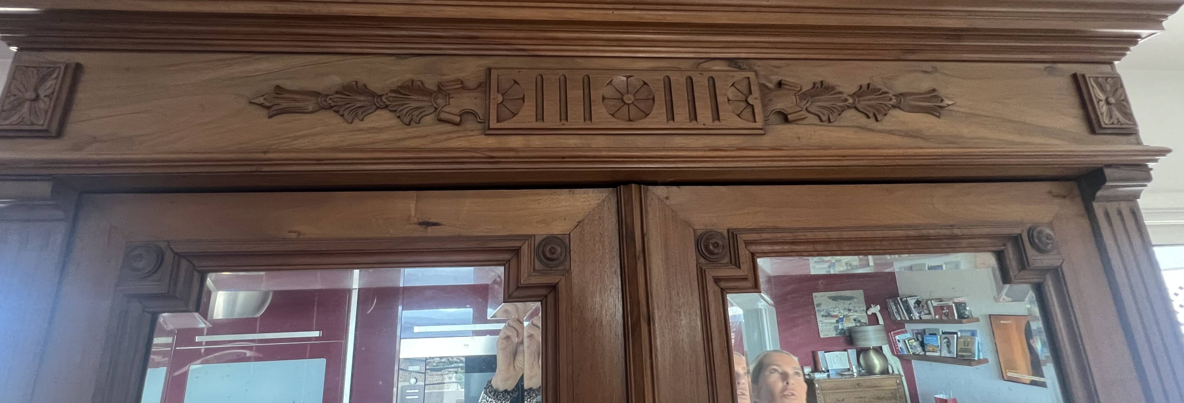 Walnut wardrobe with mirror doors.