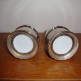 Duo of white ceramic coffee cups metal support