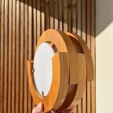 Round pine and plexiglass wall light, 1970