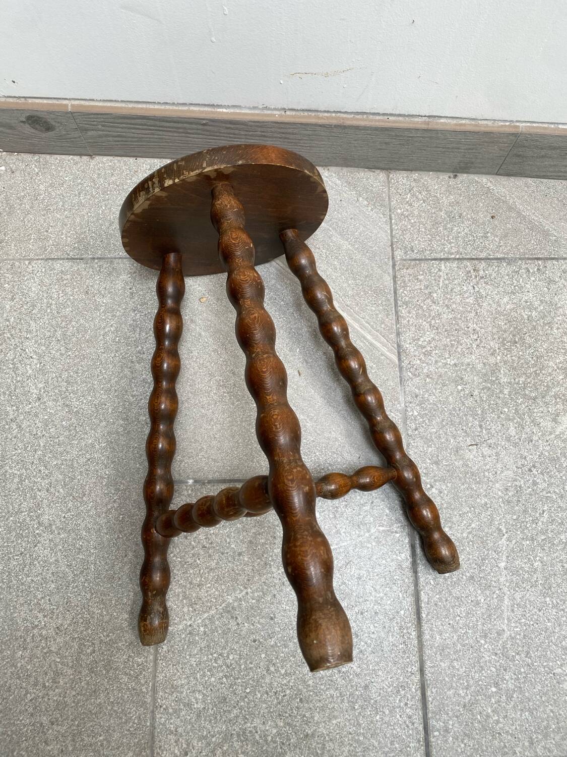 Wooden tripod farm stool