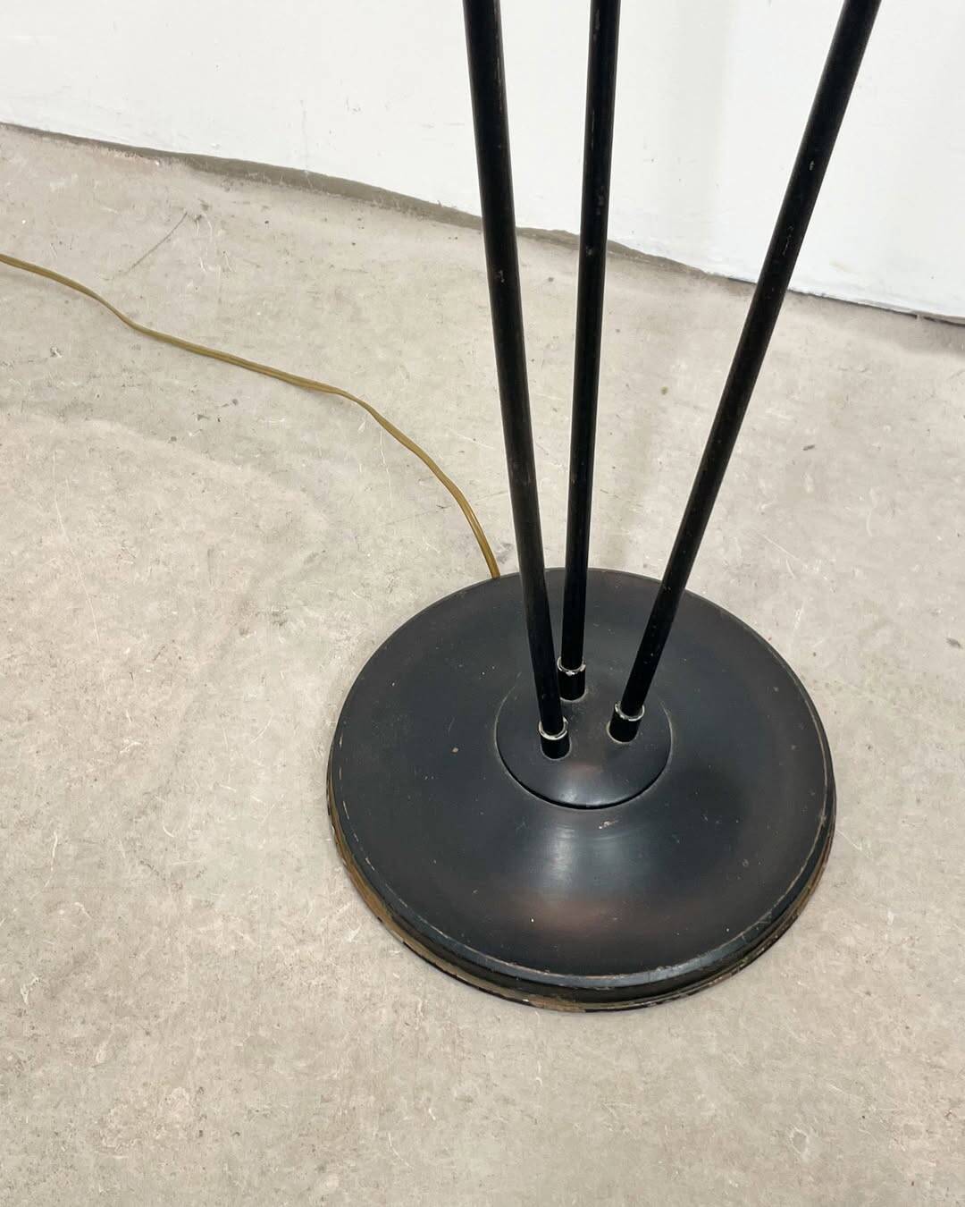 Three-light floor lamp in black lacquered metal, circa 1950.