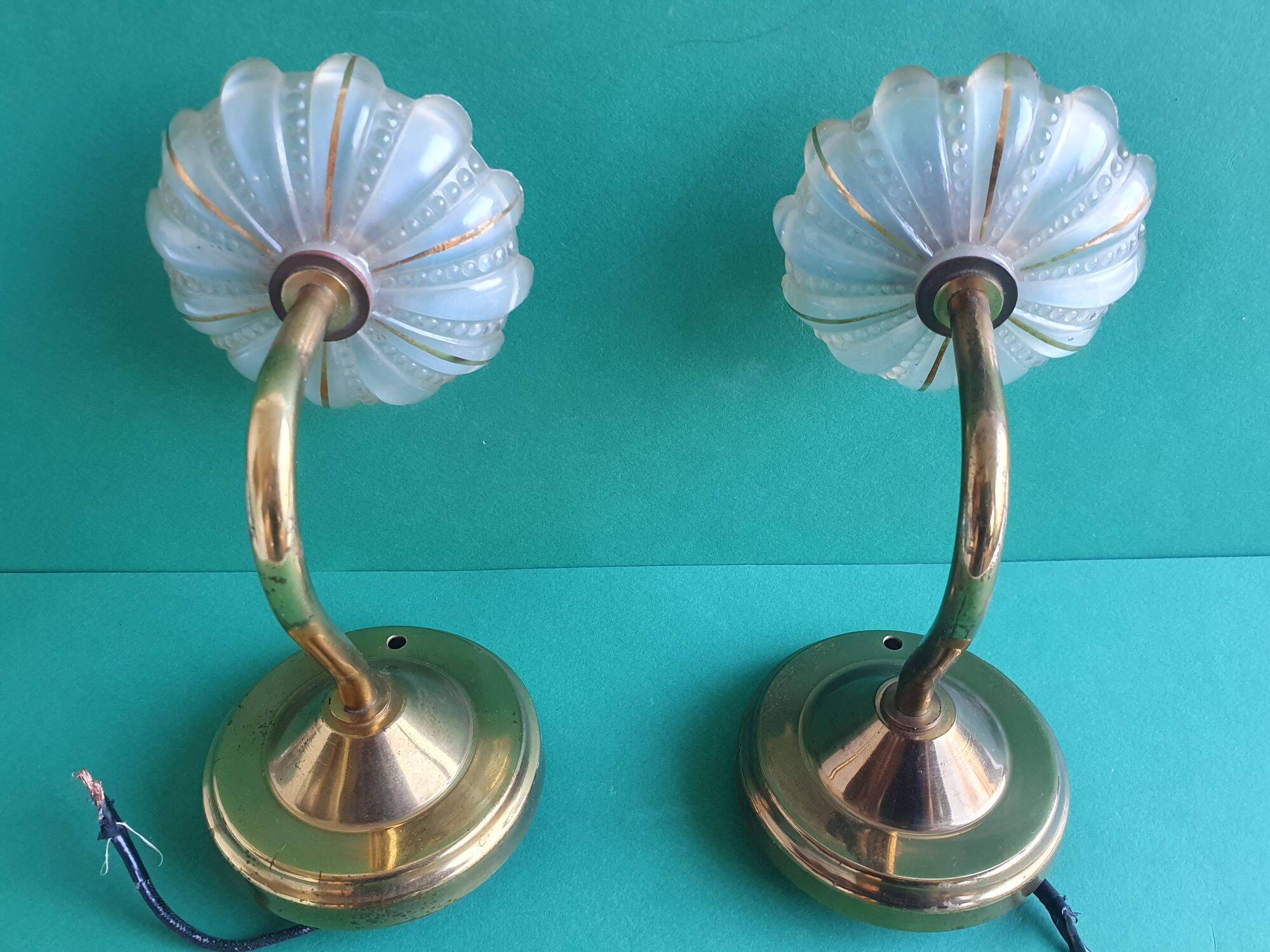 Pair of antique gold candlestick wall sconces