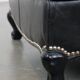 Armchair in black grained cowhide leather with a deep seat