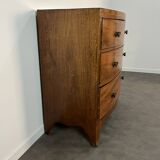 English commode from the George III Regency period, bombe shape in mahogany veneer.