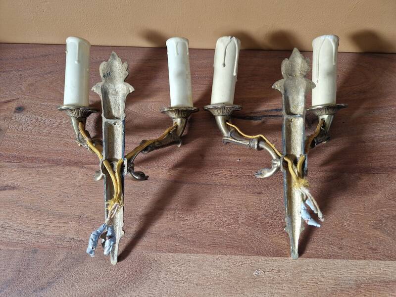 Pair of Empire-style wall sconces in gilded bronze and green lacquer.