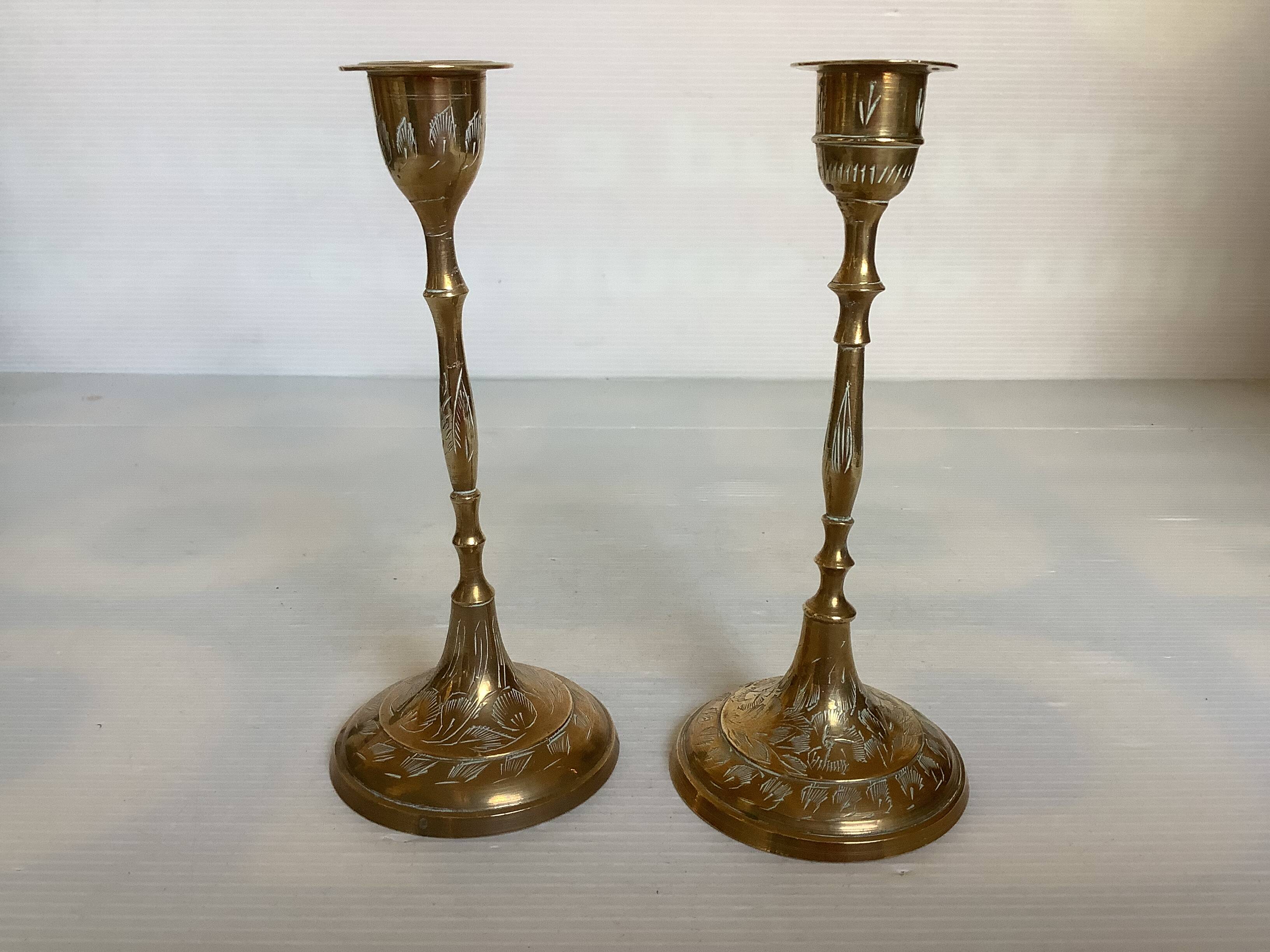 Pair of worked brass candlesticks