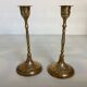 Pair of worked brass candlesticks