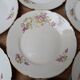 7 dessert plates in porcelain with a violet lilac design and a gold rim.