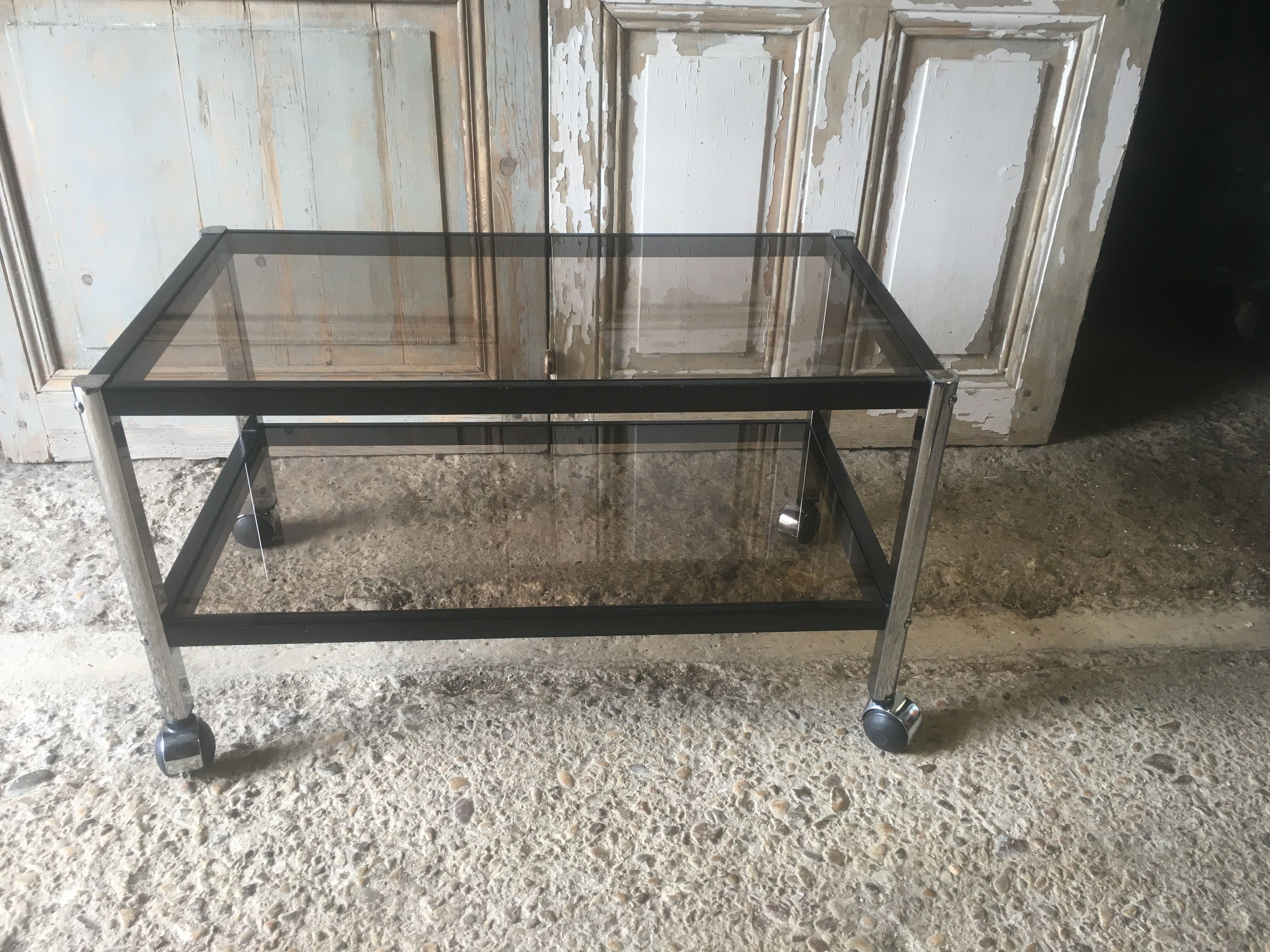 Metal coffee table with smoked glass.