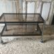 Metal coffee table with smoked glass.