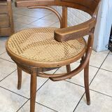 Bistro chair with a curved wooden frame and caned seat from the 1930s.