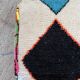 Berber floor pouf: Handwoven Moroccan wool cushion.