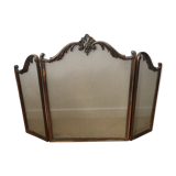 Copper-colored metal fireplace firewall