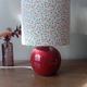 Red bedside lamp, liberty lampshade with small pink flowers.