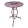 Vintage red cast iron bistro table (1950s) — round metal top, tripod base.