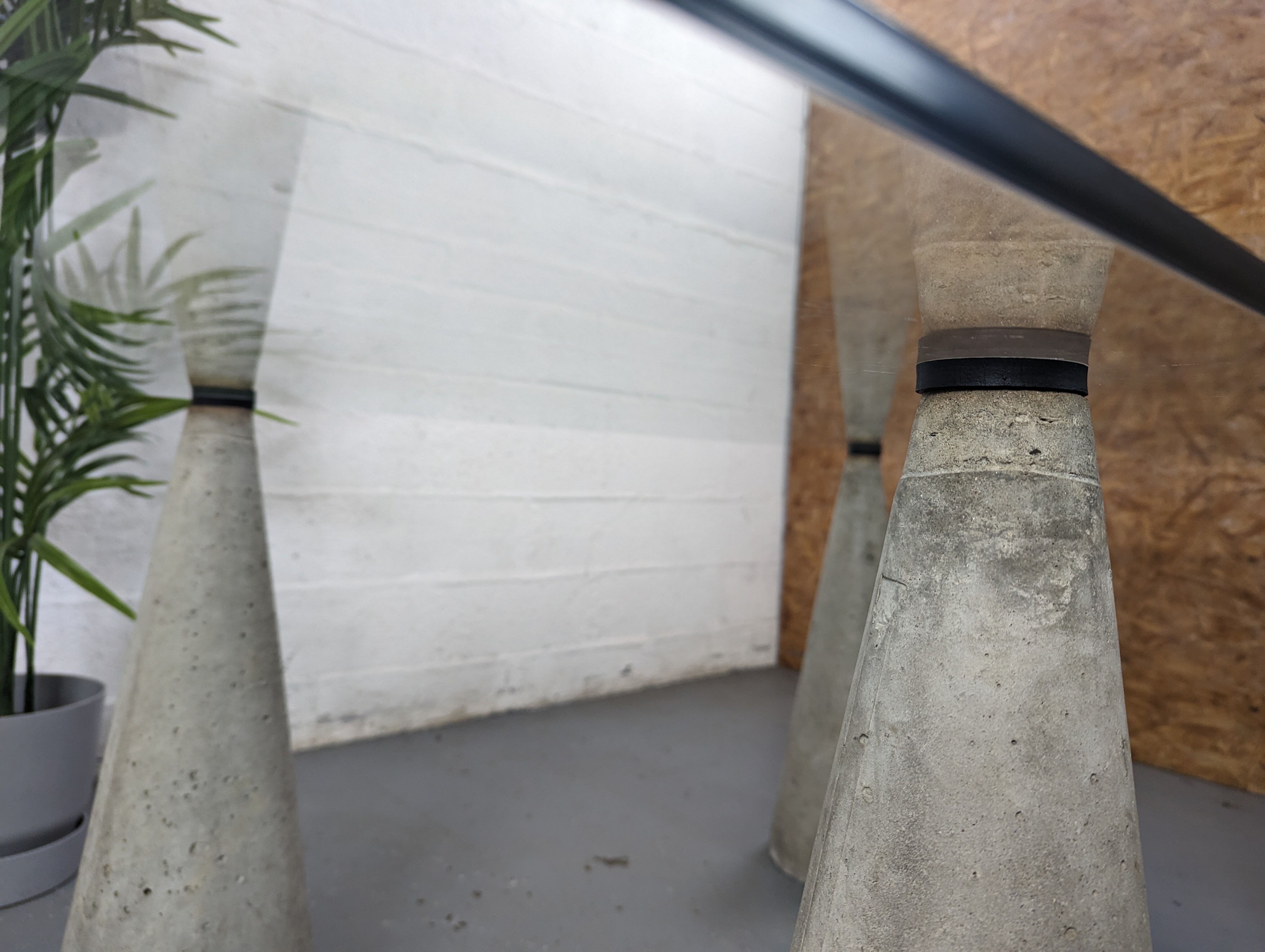 Glass table with cement legs