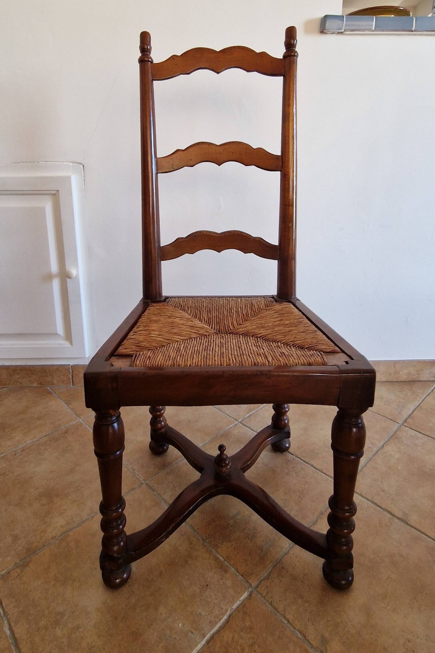 Marquetry wooden dining table with its 6 chairs.
