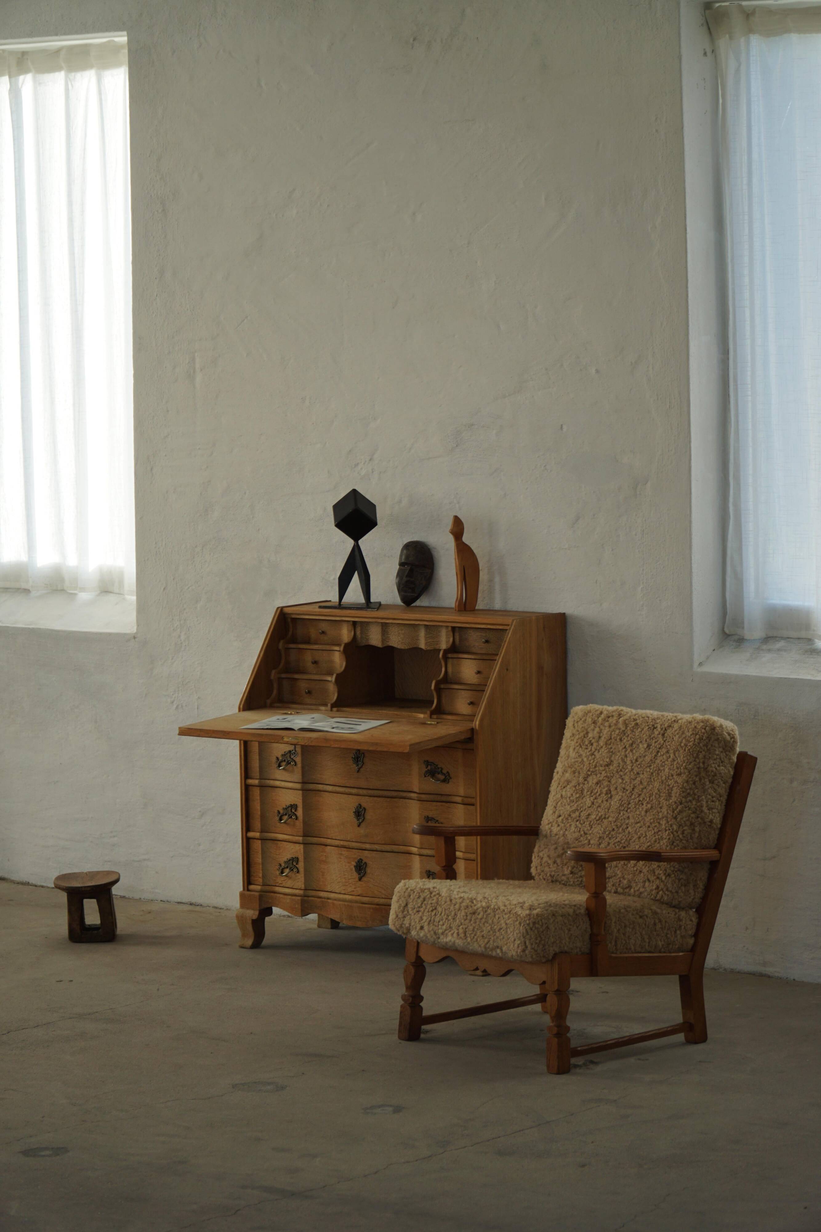 Danish modernist lounge chair in oak and lambswool, Henning Kjærnulf, 1960s