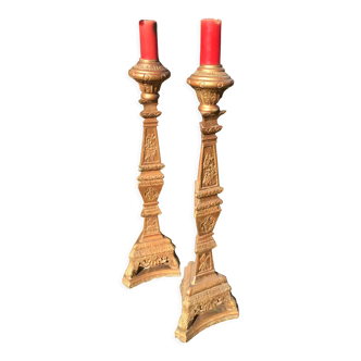 Pair of torchieres in gilded wood and richly carved