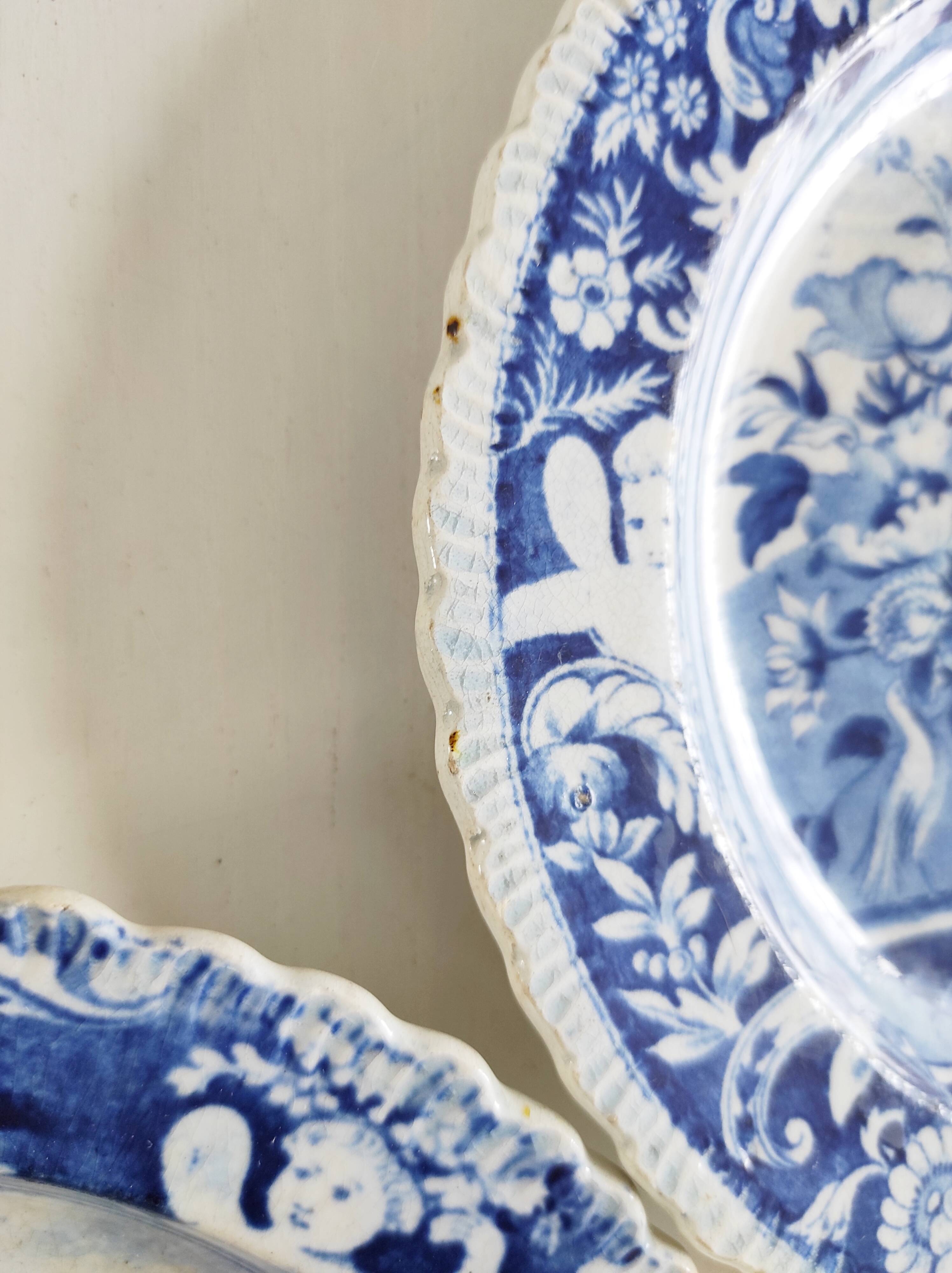 Five 19th century Calais earthenware plates with a romantic gallant couple decor