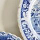 Five 19th century Calais earthenware plates with a romantic gallant couple decor