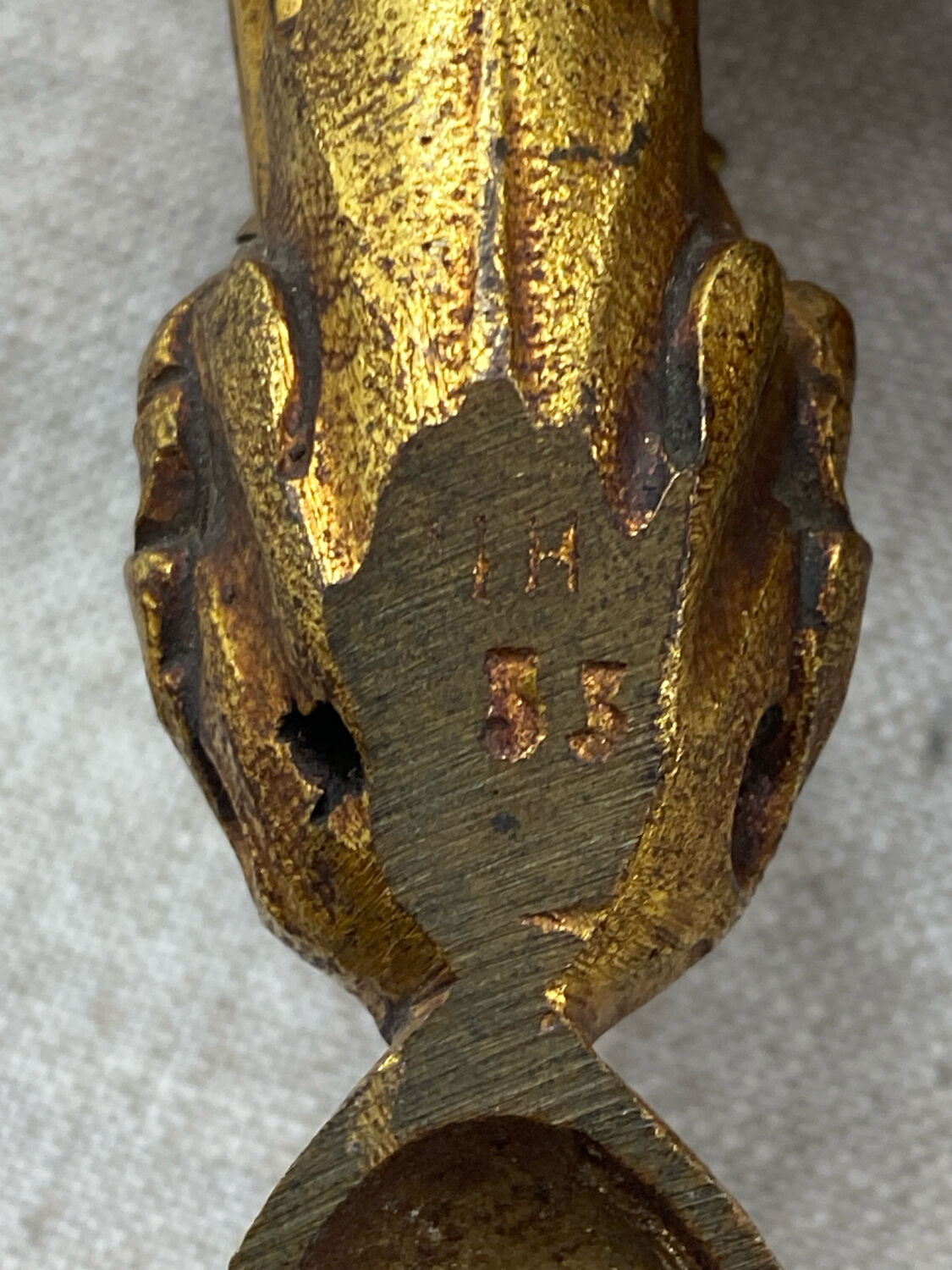 Bronze wall light, decorated with a bow and ribbon.