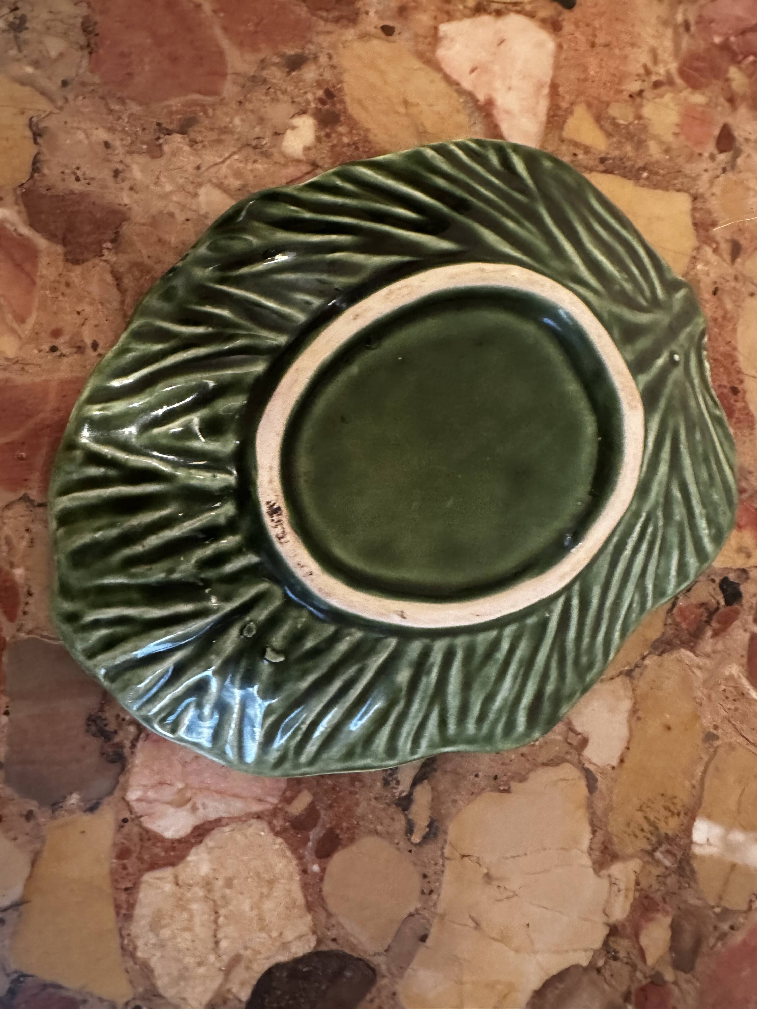 Vintage leaf-shaped green majolica catchall.