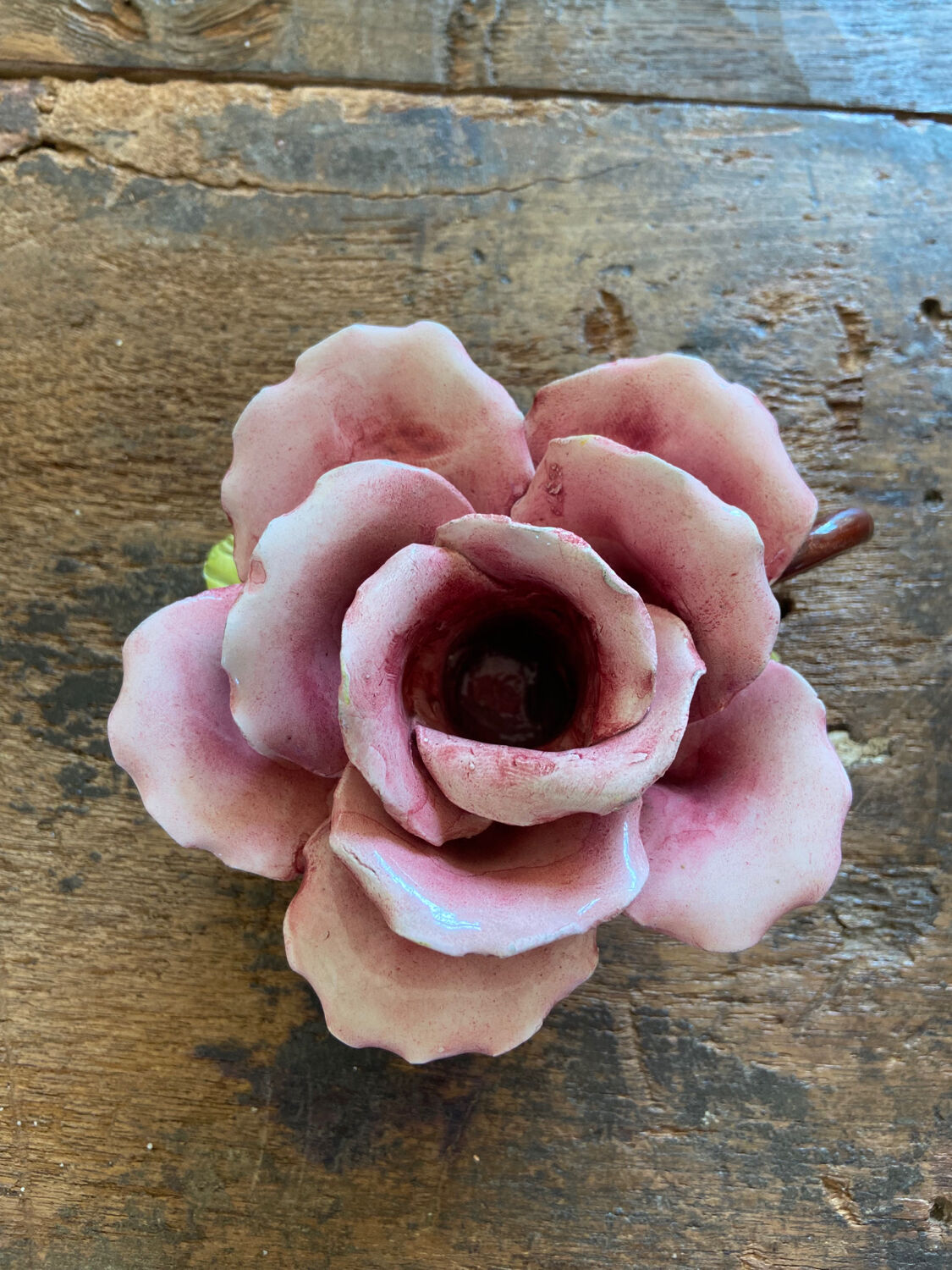 Rose-shaped earthenware candle holder