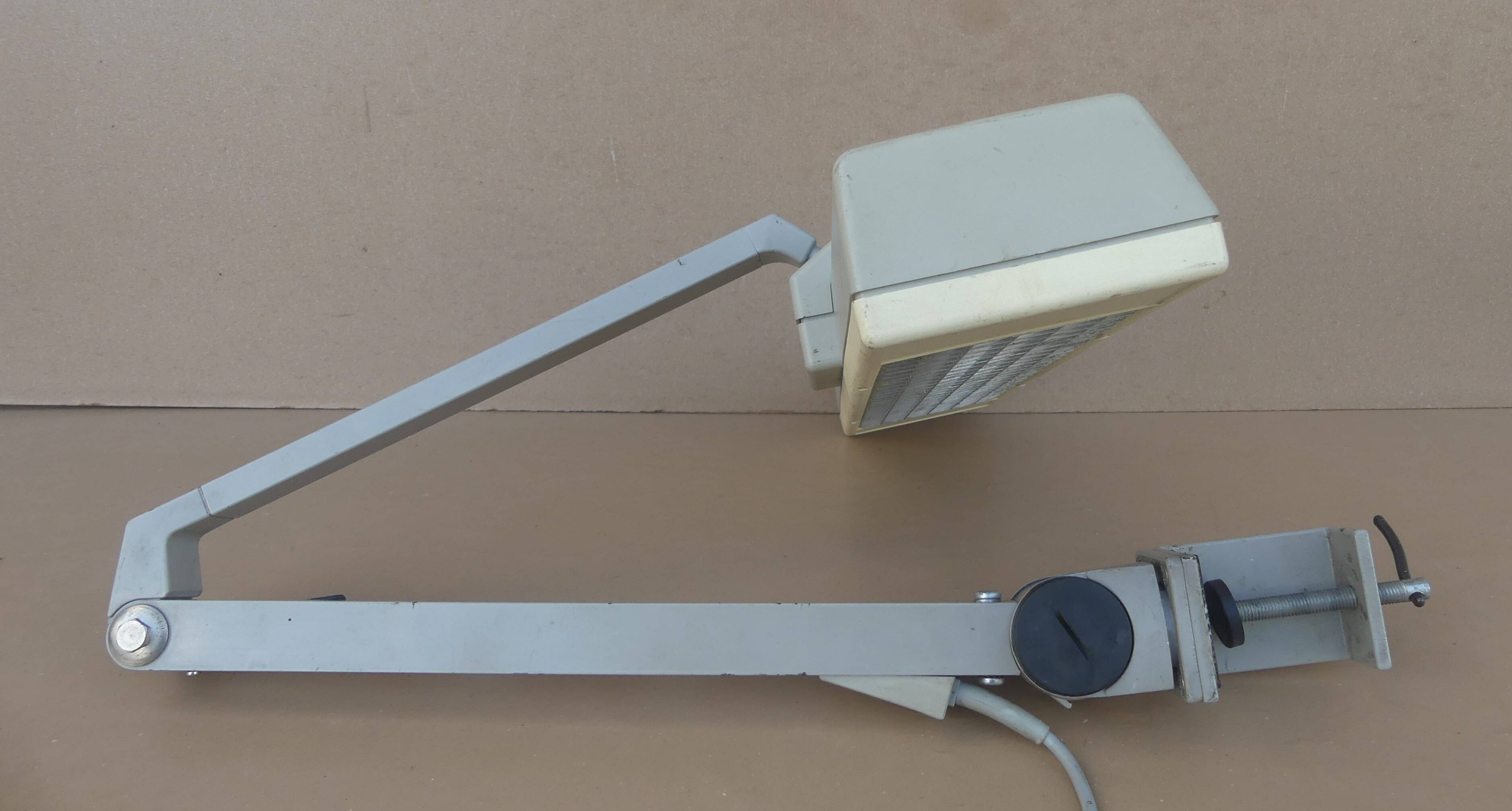 WALDMANN articulated workshop lamp with two industrial clamp arms for architects.