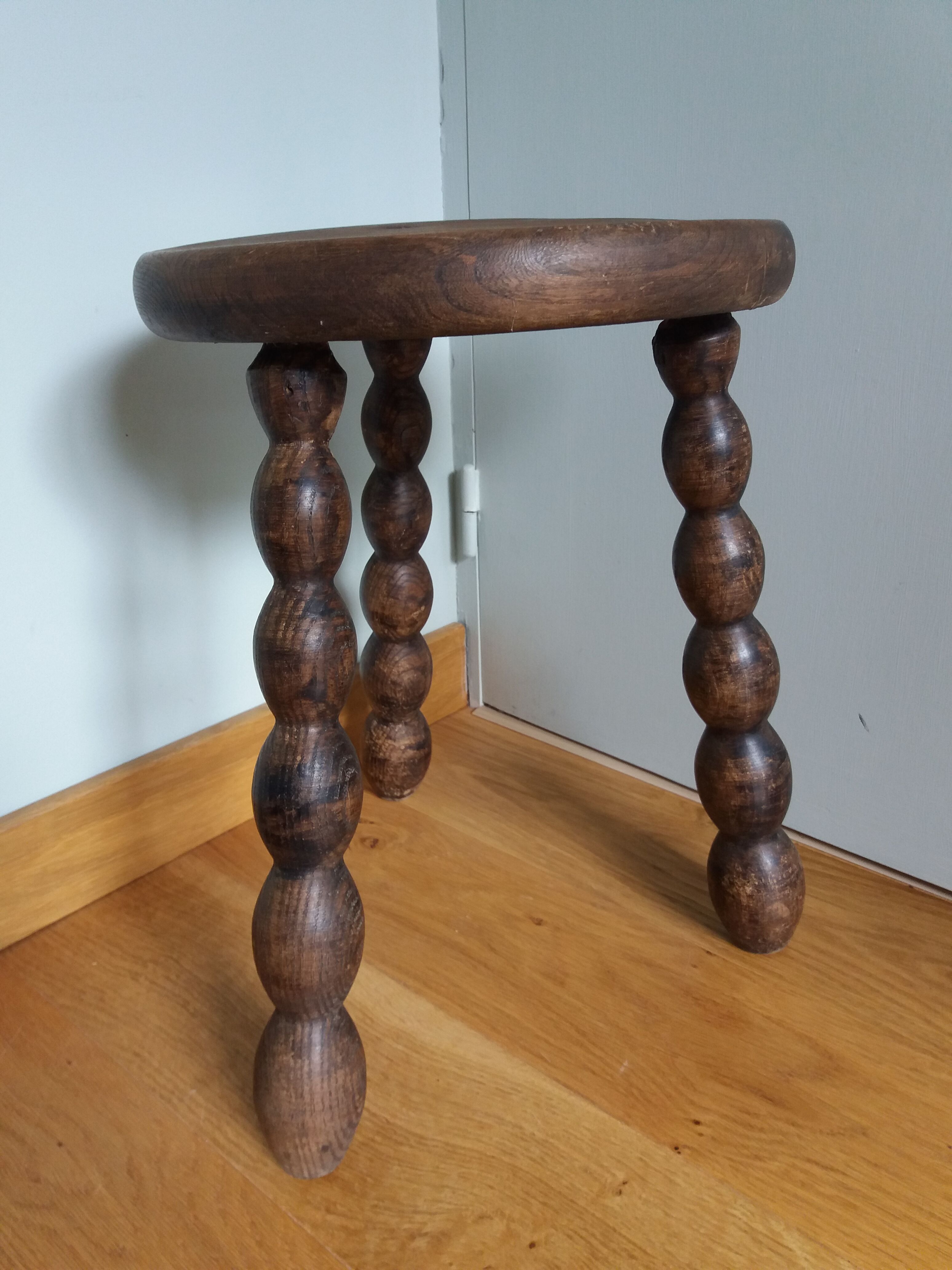 Tripod stool in wood turned coil way
