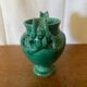 Antique green ceramic vase with handles