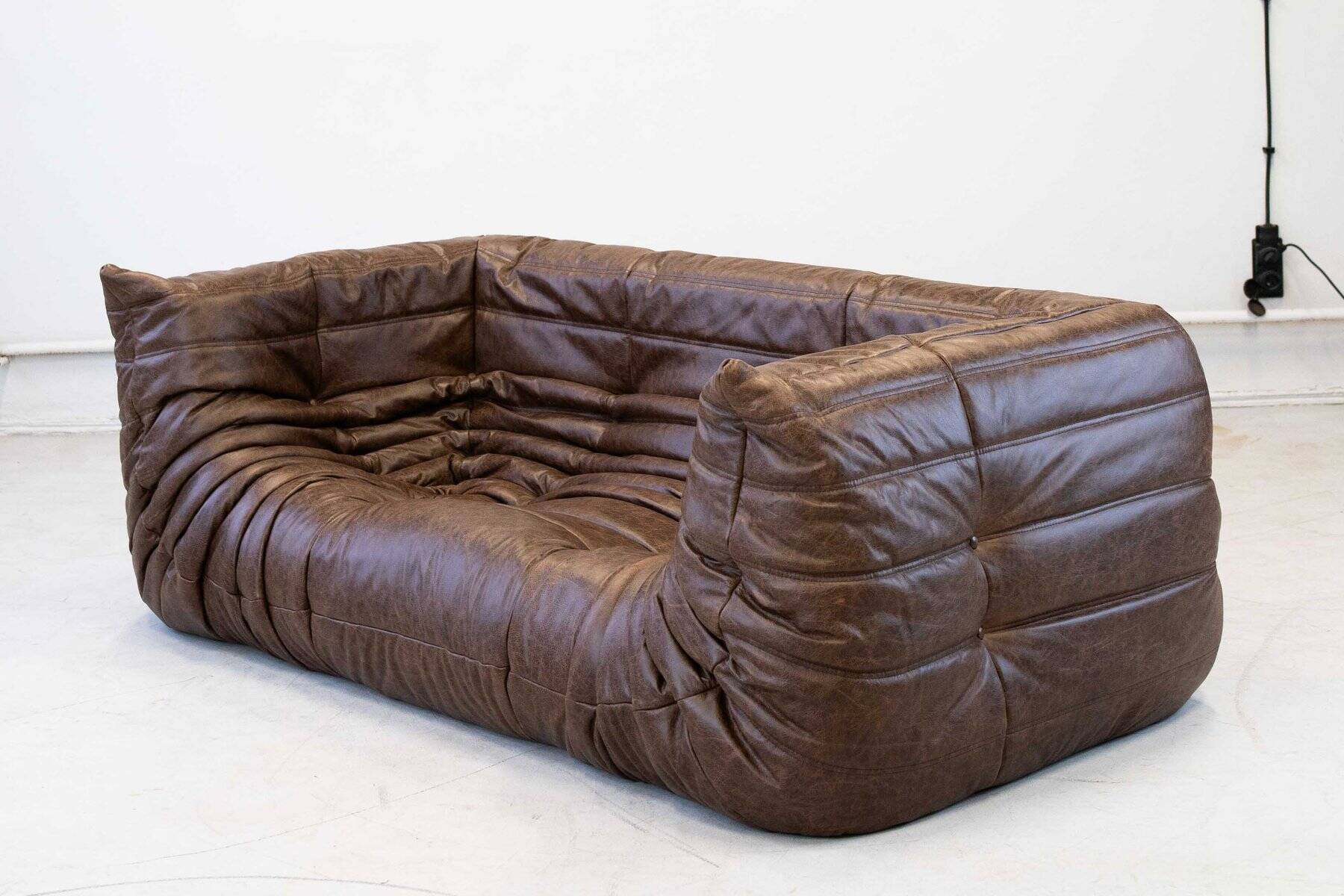 Vintage two-seater Togo sofa with arms in brown leather by Michel Ducaroy for Ligne Roset, 1970s