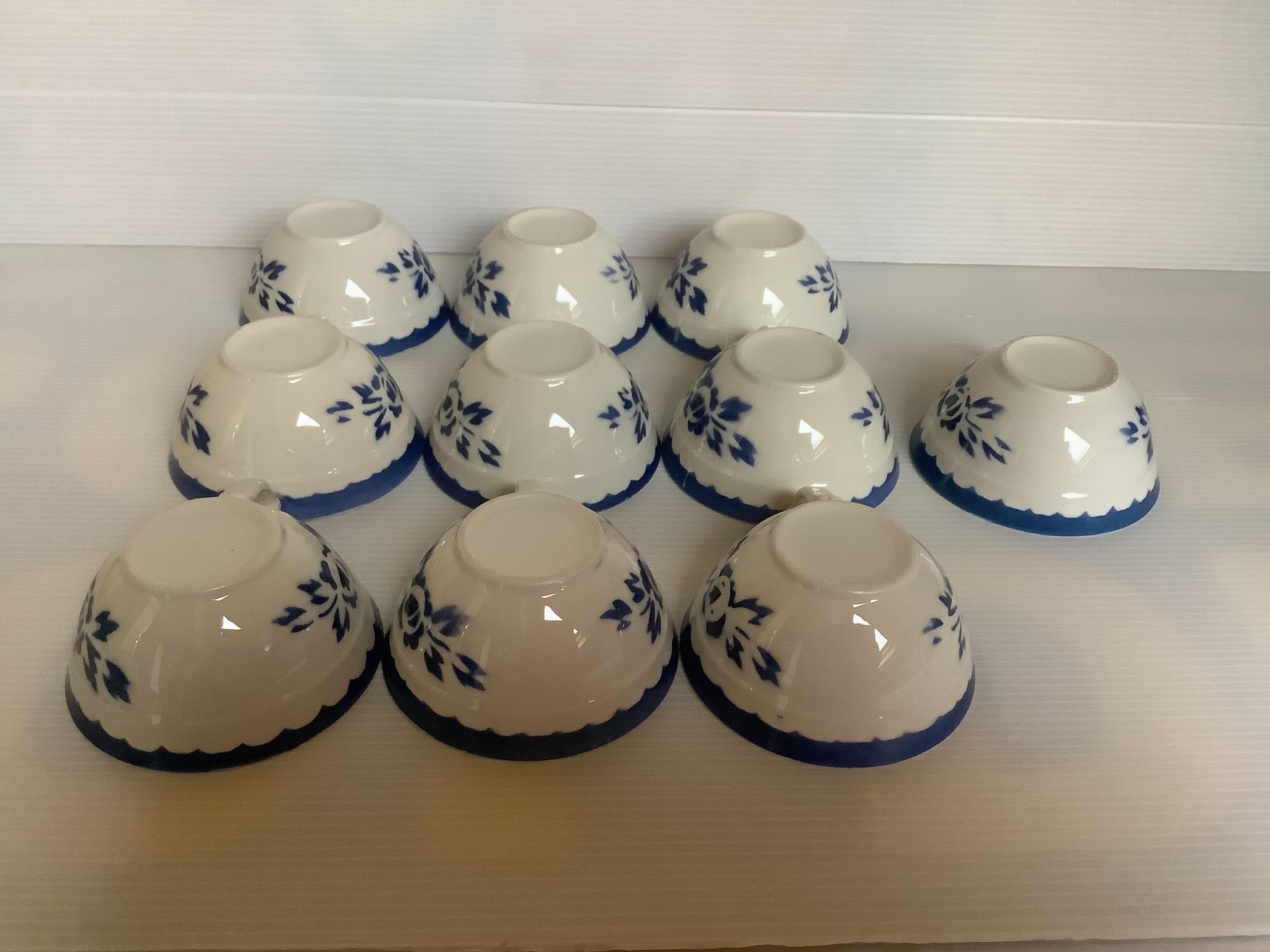 10 old earthenware cups with blue flowers and stencils