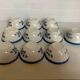 10 old earthenware cups with blue flowers and stencils