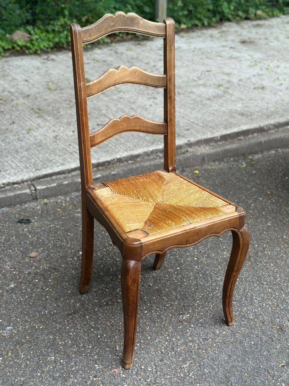 French provincial style chair in solid wood with rush seating.
