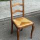 French provincial style chair in solid wood with rush seating.