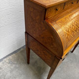 Cylinder desk with marquetry featuring a crosshatch design.
