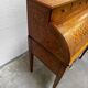 Cylinder desk with marquetry featuring a crosshatch design.