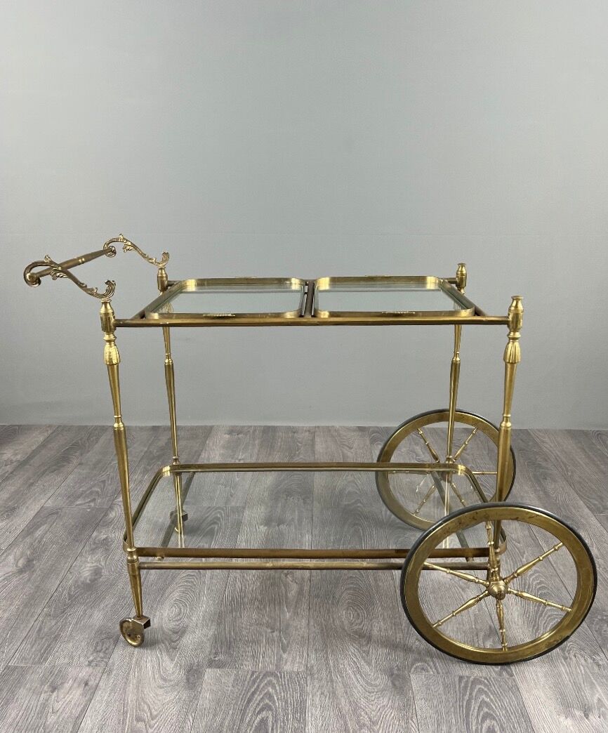 Rolling table cart in gilded brass with two glass shelves, 20th century.