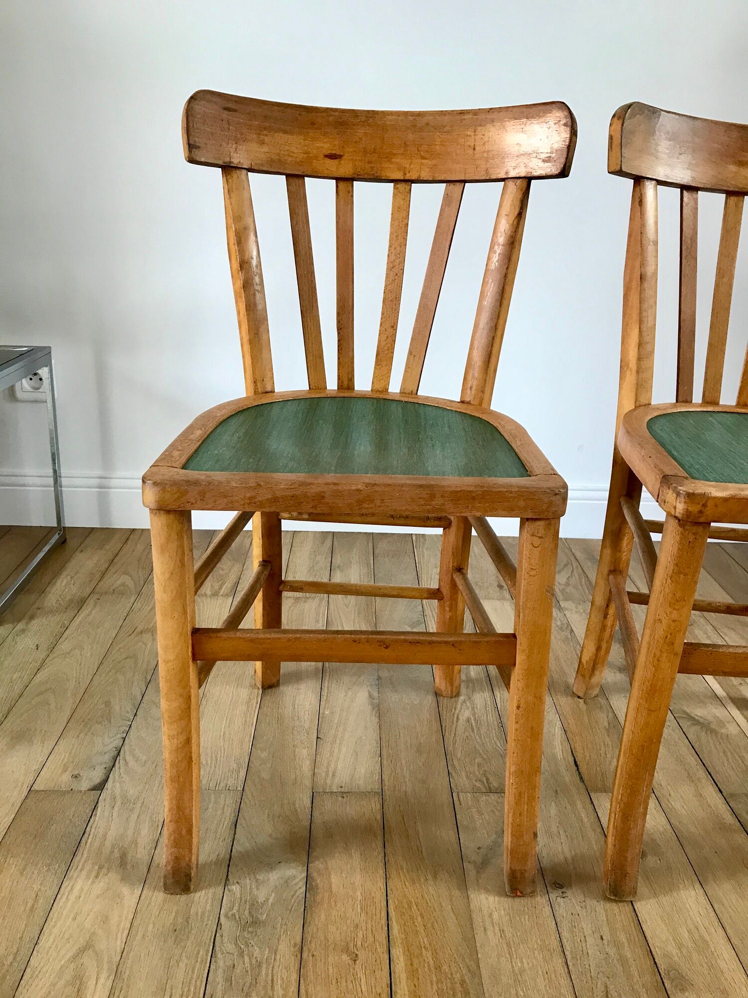 Pair of bistro chairs in light curved wood and green seat 1950s