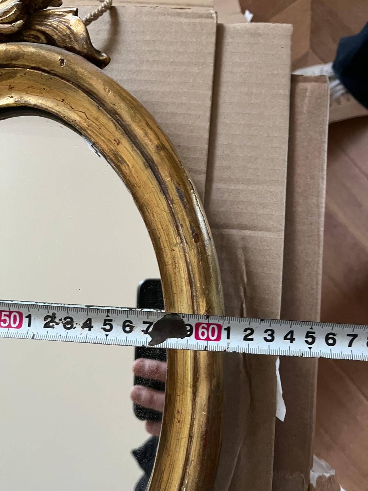 Large wall mirror with a gilded brass frame in Louis XV style.