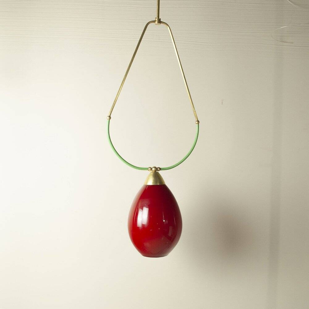 Hanging lamp with a brass frame in the shape of scales and a red-purple Murano glass diffuser.