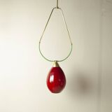 Hanging lamp with a brass frame in the shape of scales and a red-purple Murano glass diffuser.