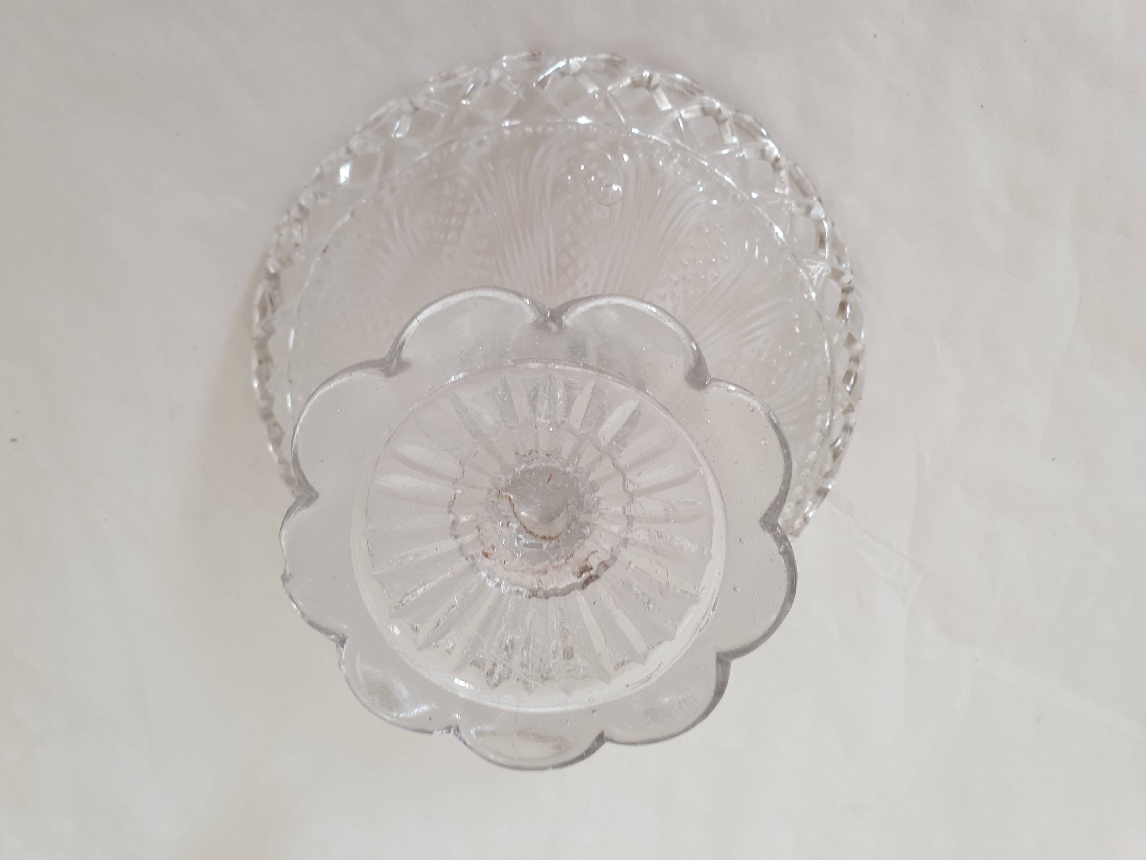 Old cup in molded glass colorless decorative table mignardises