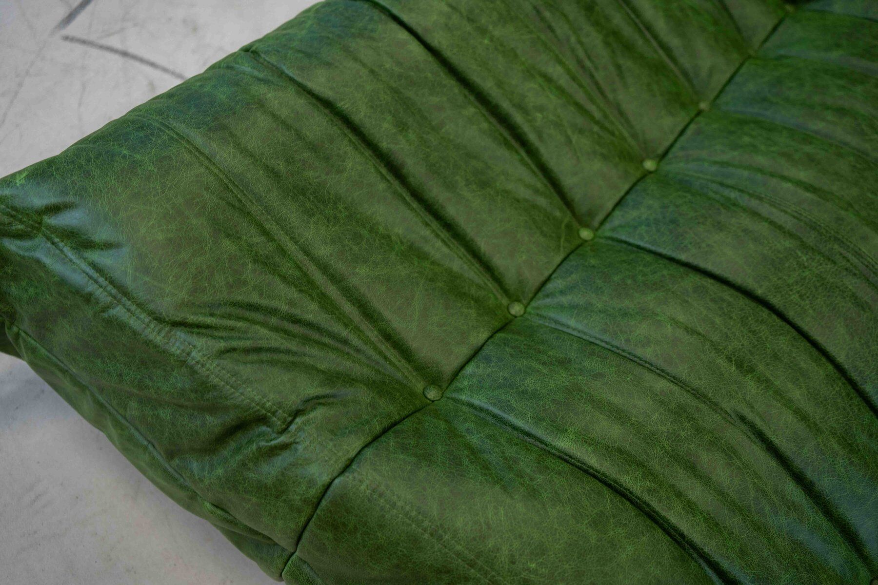 Togo chaise lounge in green leather attributed to Michel Ducaroy for Ligne Roset, 1974