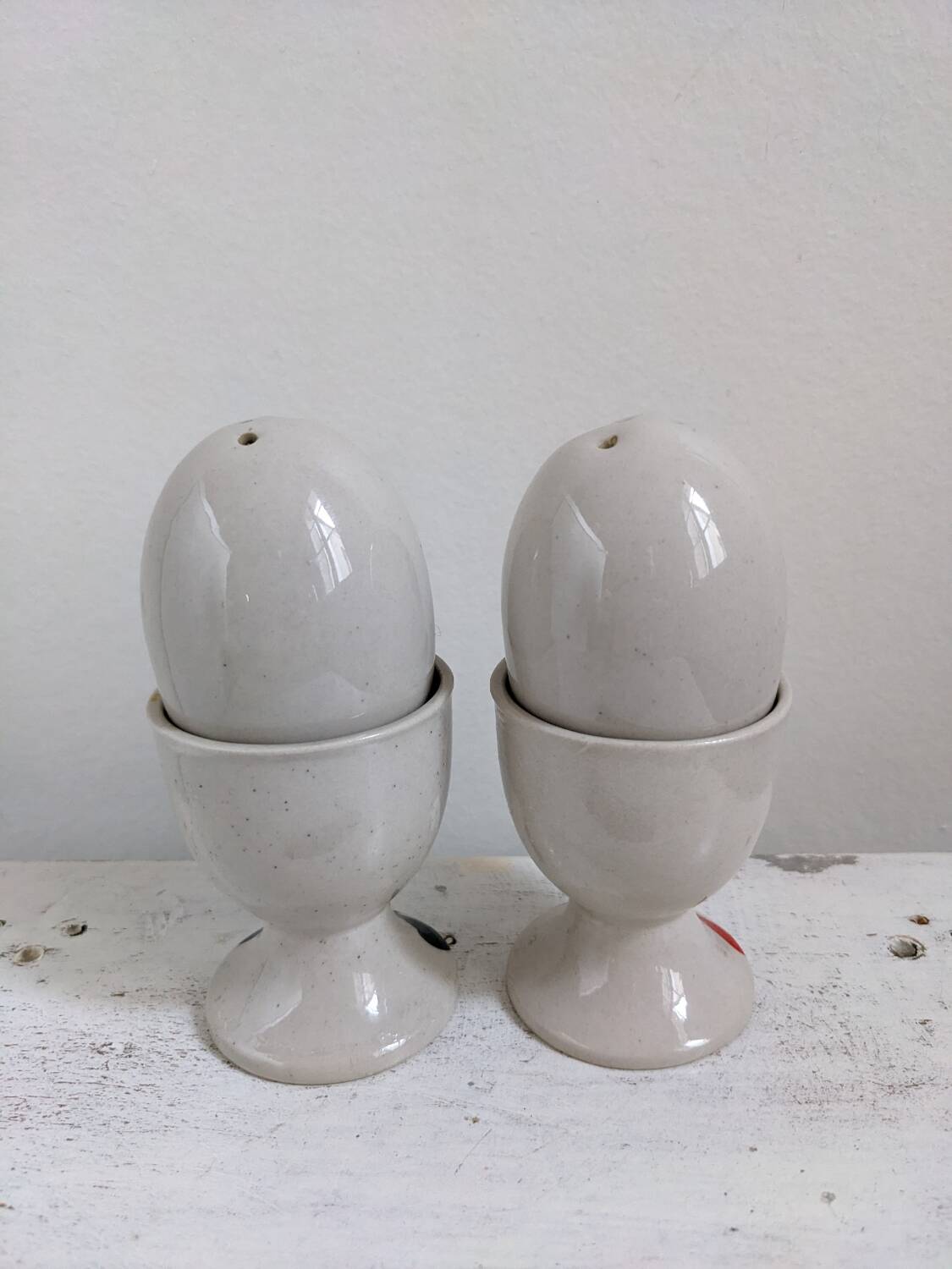 Egg cup, salt and pepper shaker duo