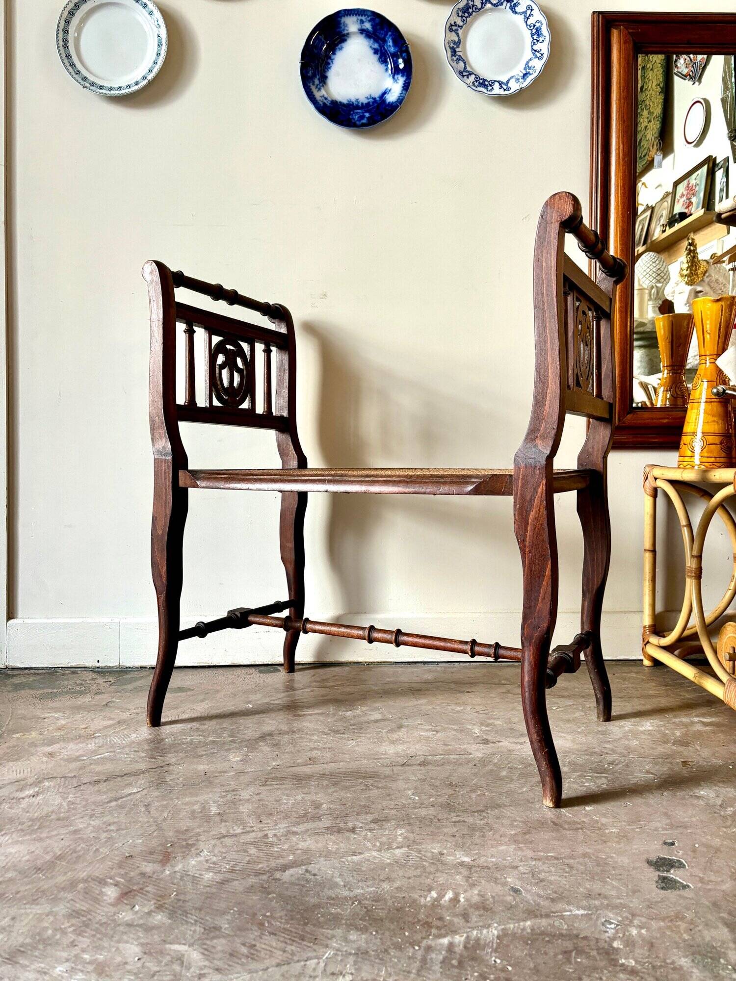 Dark wood and cane bench