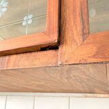 Art Deco-style wall-mounted display cabinet with floral engraving